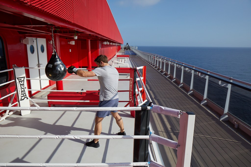 Man works out in the boxing area at Training Camp.